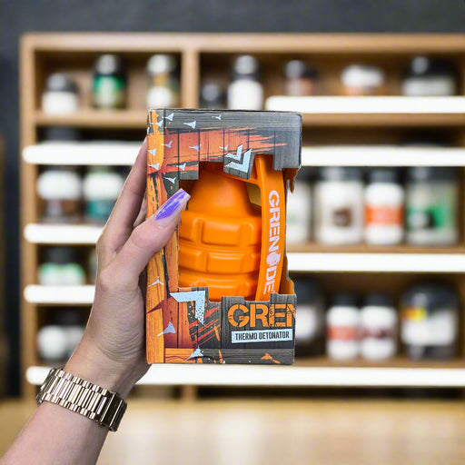 Close-up of (Grenade Thermo Detonator Weight Management Supplement Tub of 100 Capsules) held up inside My Supplement Shop, clearly showing the front label in a Sports Nutrition setting.