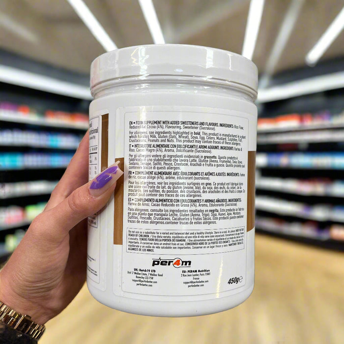 Close-up of (Per4m Cream of Rice 450g – Gluten-Free, Plant-Based Energy Snack) held up inside My Supplement Shop, clearly showing key ingredients on the packaging in a Sports Nutrition setting.