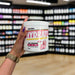 Close-up of (Per4m Hydration Electrolyte Mix 30 Servings) held up inside My Supplement Shop, clearly showing the front label in a Sports Nutrition setting.